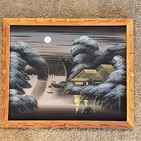 Full view of framed silk painting showing moonlit seascape and bamboo-style frame
