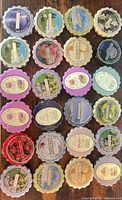 Full overhead view of all 24 Yankee Candle wax melts arranged in five rows on wooden surface