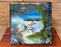 full view of painted ceramic tile on stand