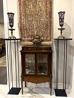 Both pedestal stands flanking cabinet, full height view