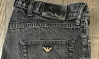 Back waistband with leather AJ patch and metal eagle logo on pocket