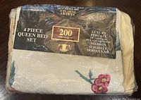 Front of sealed sheet set showing 4-piece queen bed set, 200 thread count label