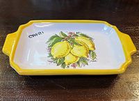 Top view of tray showing lemon design, yellow rim and CAPRI script