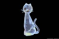 Front view of clear cut crystal cat figurine with metal whiskers