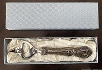 Opener in original box with tissue wrap