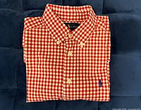 Folded red and white gingham Ralph Lauren boys shirt with visible navy pony logo