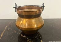 Full view of copper cauldron pot front and side profile