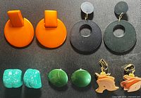 Front view of all five pairs of earrings