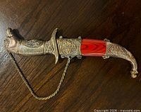 Dagger in sheath showing overall design and chain