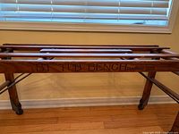 Close view of patent stamp on wooden slat bench