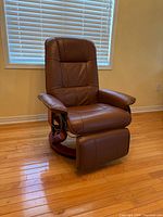 Front view of brown faux leather recliner chair upright