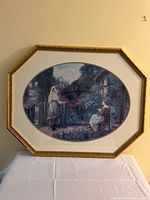 Full view of framed print on table