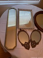 All five mirrors laid out showing shapes and frames