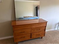 Front view of dresser with mirror on top