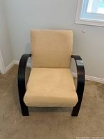 Front view showing beige microfiber seat, backrest, and curved dark wood arms/legs