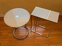 Top view of both tables showing shapes and reflective glass tops
