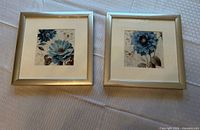Both framed prints side by side