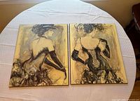 Both artworks side by side on tabletop