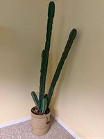 Full view of artificial cactus in crock