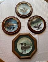 Front view of all four framed plates
