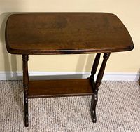 Full view of table front showcasing top, legs, lower shelf