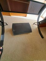 Footrest placed under desk showing platform surface