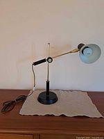 Lamp overall, arm extended, cord visible