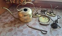 All seven brass items displayed