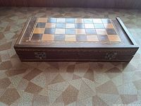 Top view of closed wooden inlaid chess board