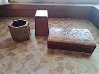 Front view of three wooden pieces closed