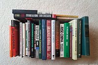 Group of economics books showing spines, titles visible