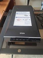 Closed scanner showing exterior and front control panel