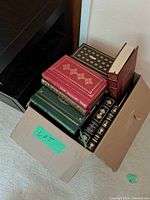 Box of leather-bound Franklin Library books showing multiple volumes