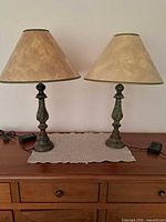 Both matching lamps on dresser