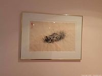 Framed sumi-e tiger painting on wall