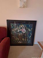 front view of framed artwork leaning against wall