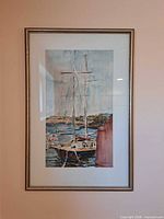Front view of framed sailboat painting with mat and metallic frame