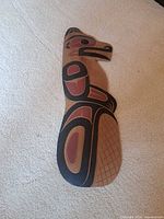 Full view of Coast Salish beaver wood carving plaque