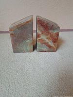 Front view of both agate bookends displaying color banding