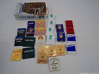 Overall view showing carton and laid-out matchbooks