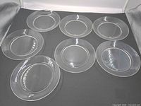 All six clear glass plates laid out