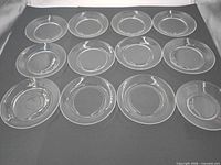 Overhead view of all 11 clear glass plates