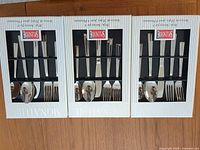 Three Splendide Signature flatware boxes front view