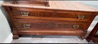 Front view showing two drawers, veneer, marble top, feet