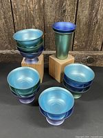 Full set showing stacks of bowls and single tumbler