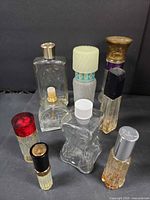 Group of assorted perfume bottles showing shapes, caps and glass styles