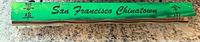 Green matchbox exterior showing San Francisco Chinatown text and Chinese characters