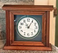 Front view of Noel Woodcraft mantel clock showing dial and case