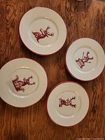 Four dessert plates arranged on wooden surface