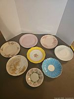 Group shot of all ten assorted saucers